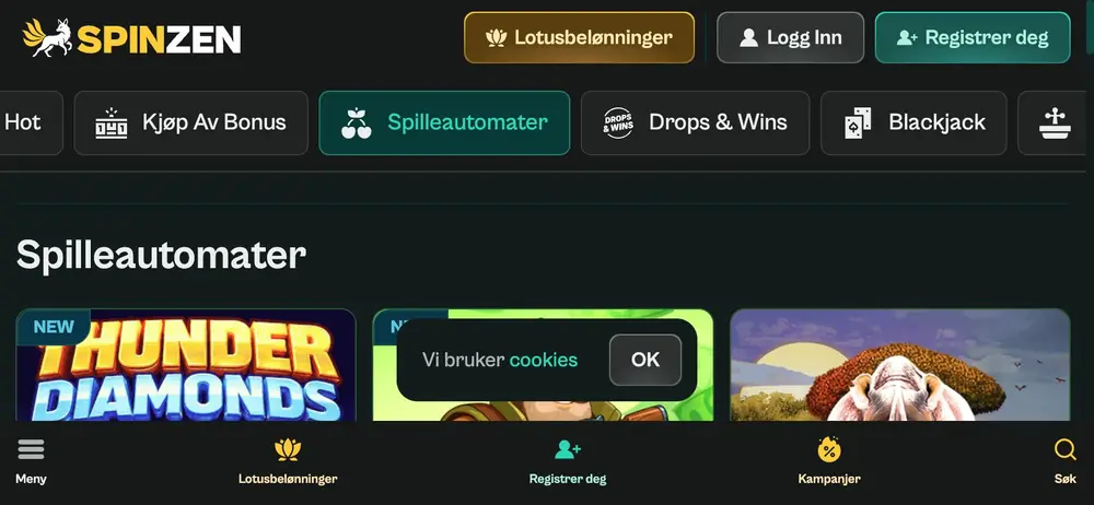 iPhone-visning på tvers med skrivebordets toppfelt, kategoriknapper, tre spillfliser og cookie-melding midt på